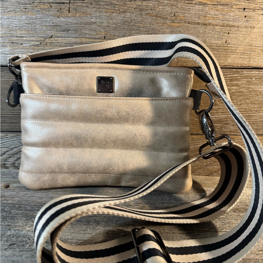 Elegant Think Royln shimmery champagne bum Bag with Striped Strap